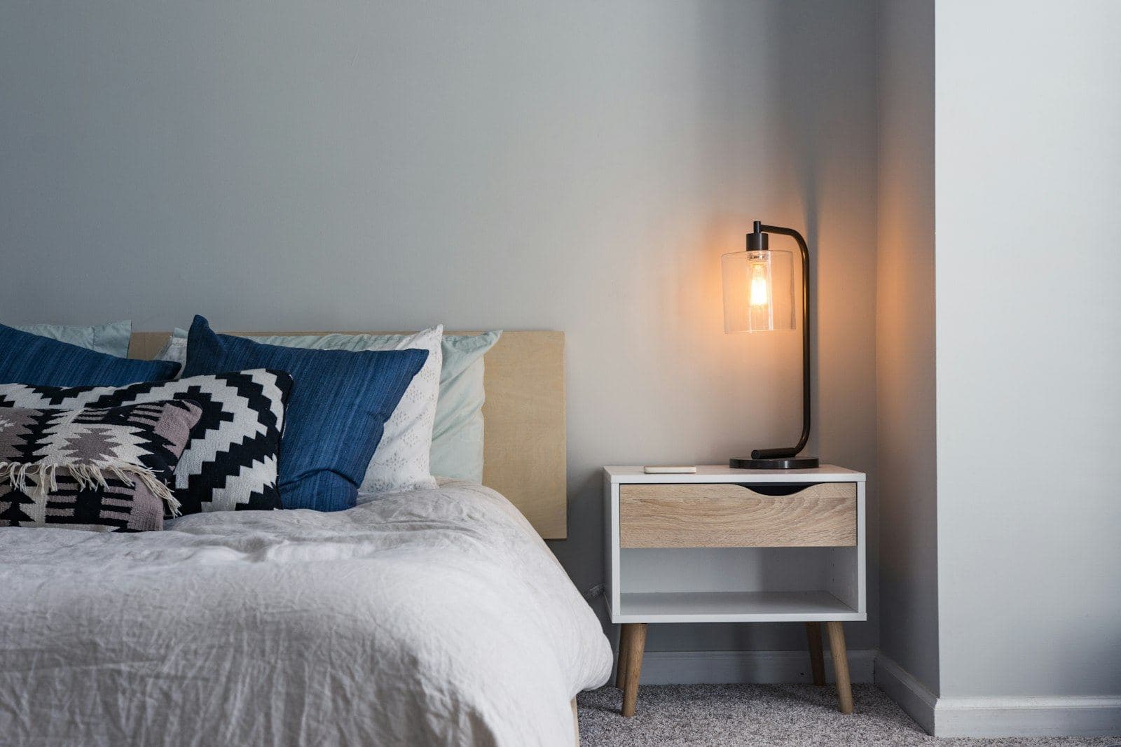 A bright, tidy bedroom with morning light
